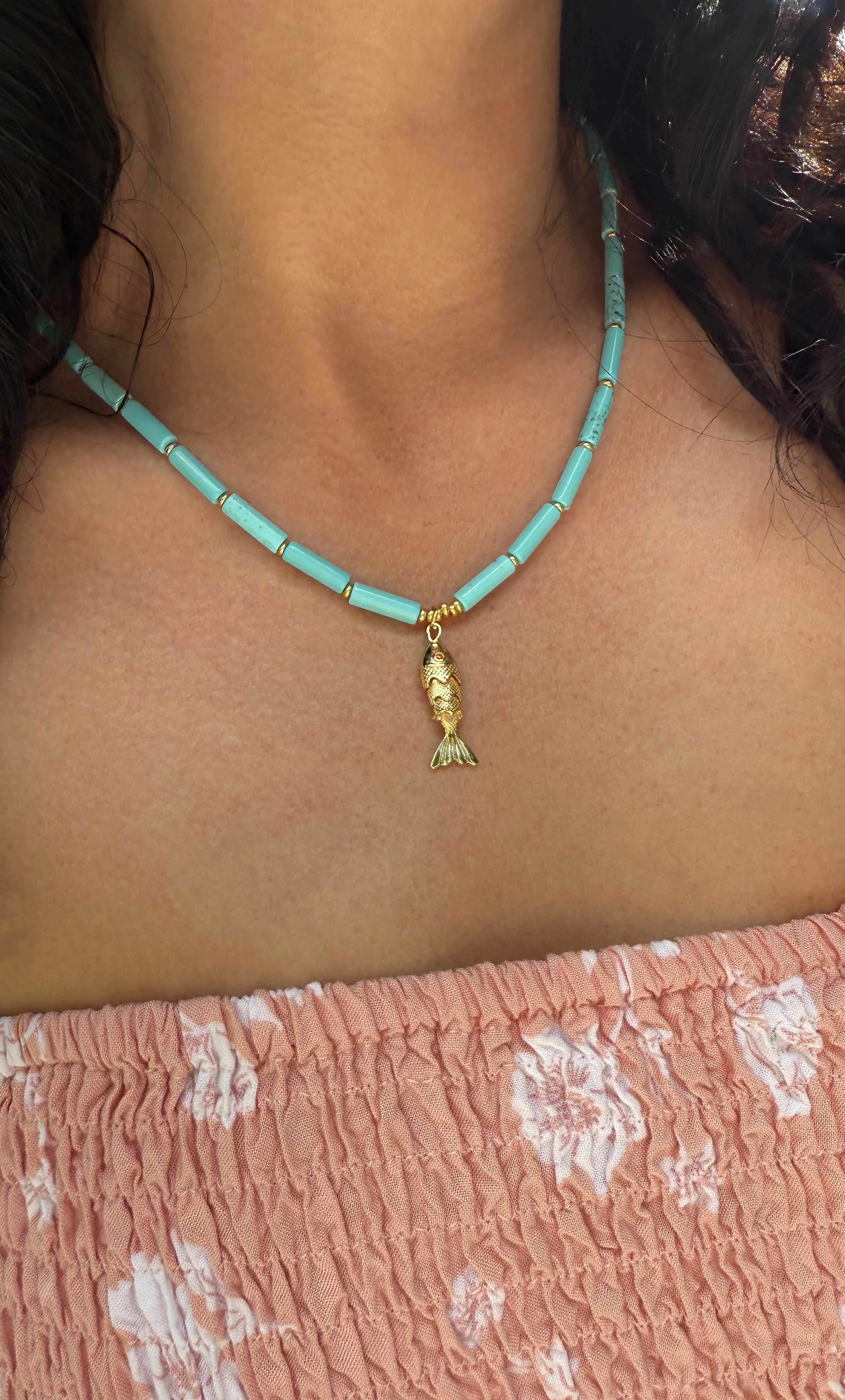 The Tunik Howlite Beaded Fish Charm Necklace