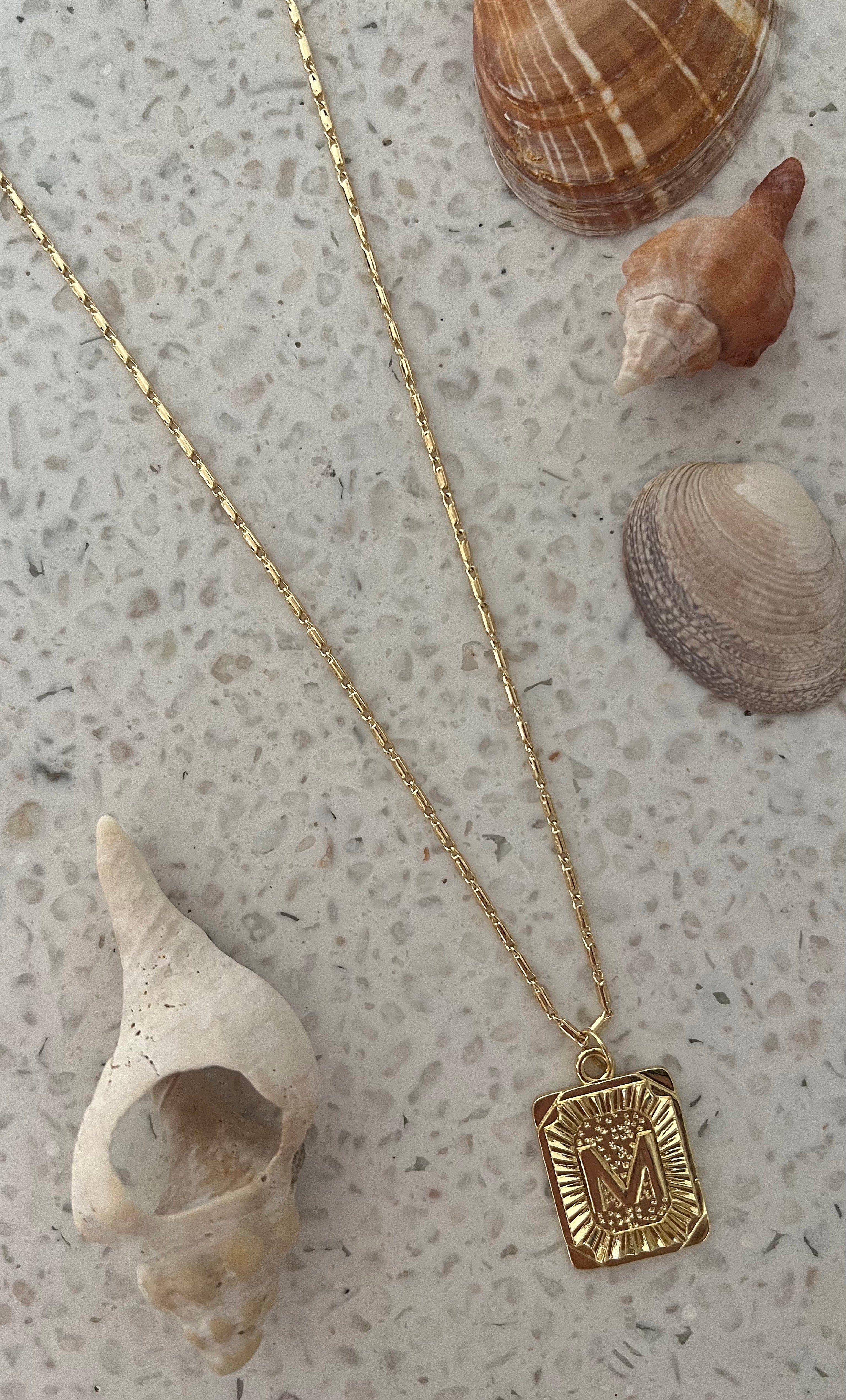 The Tunik Namesake Charm Necklace