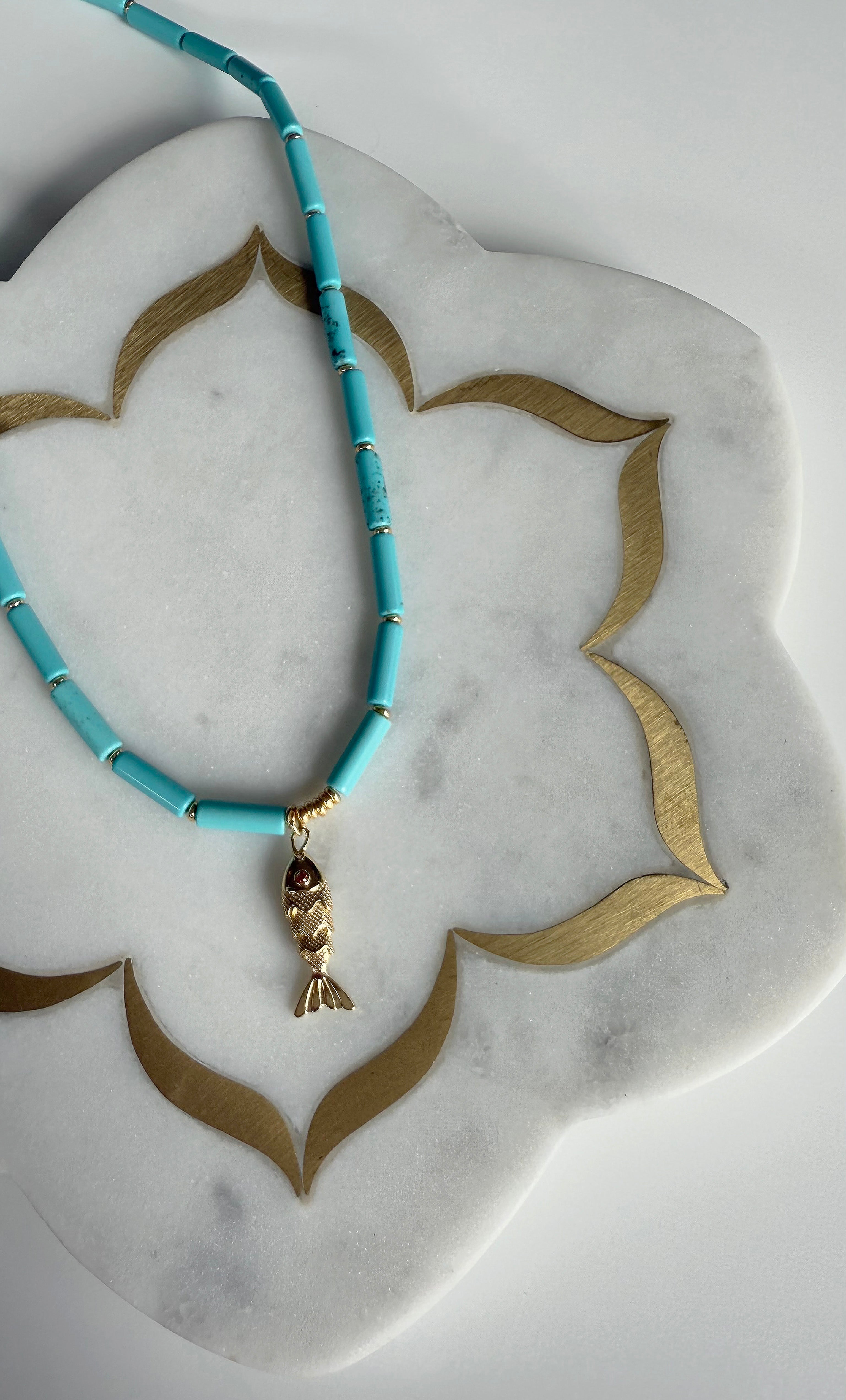 The Tunik Howlite Beaded Fish Charm Necklace